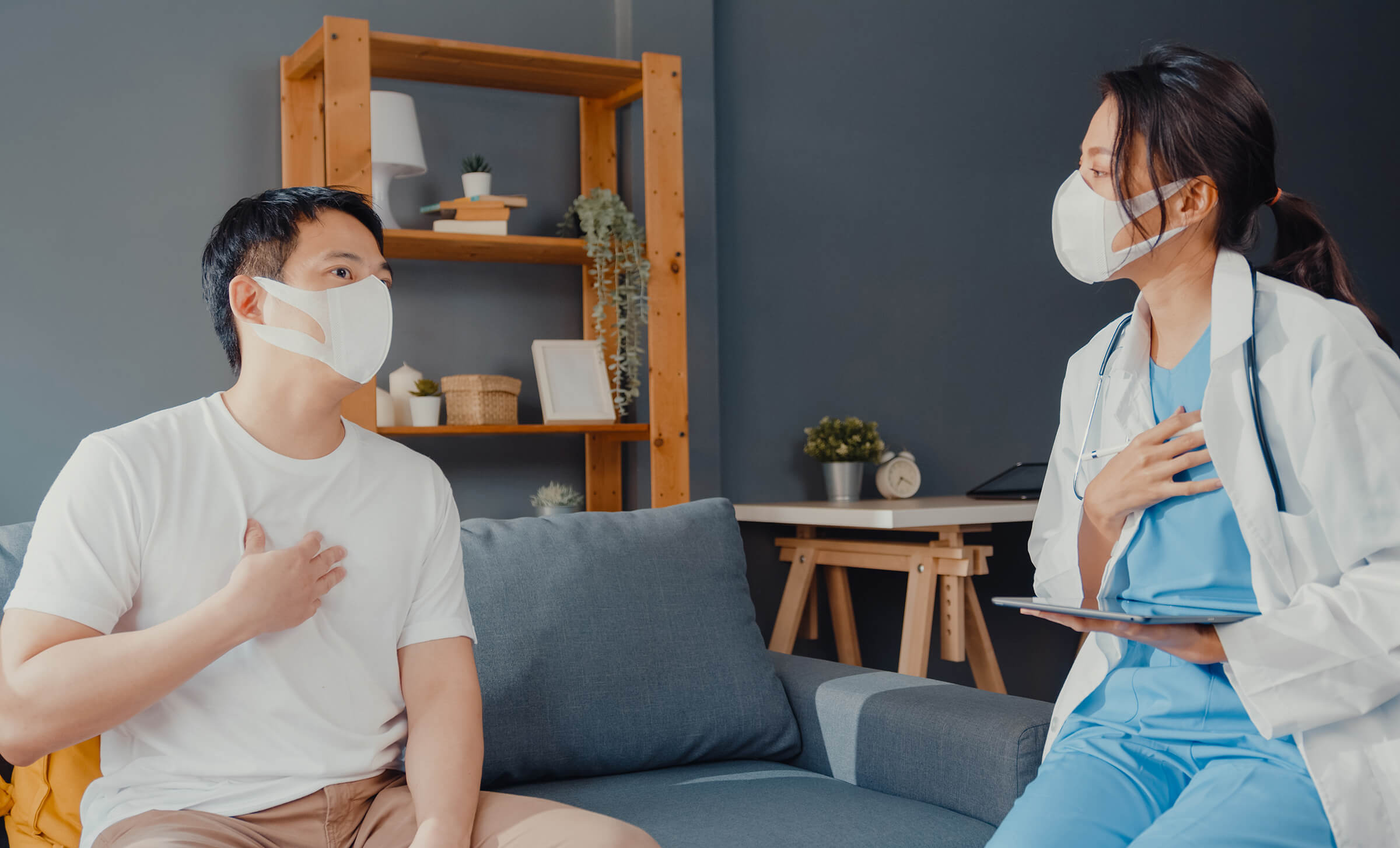 young-asia-female-physician-doctor-wear-face-mask-talking-to-covid-19-patient